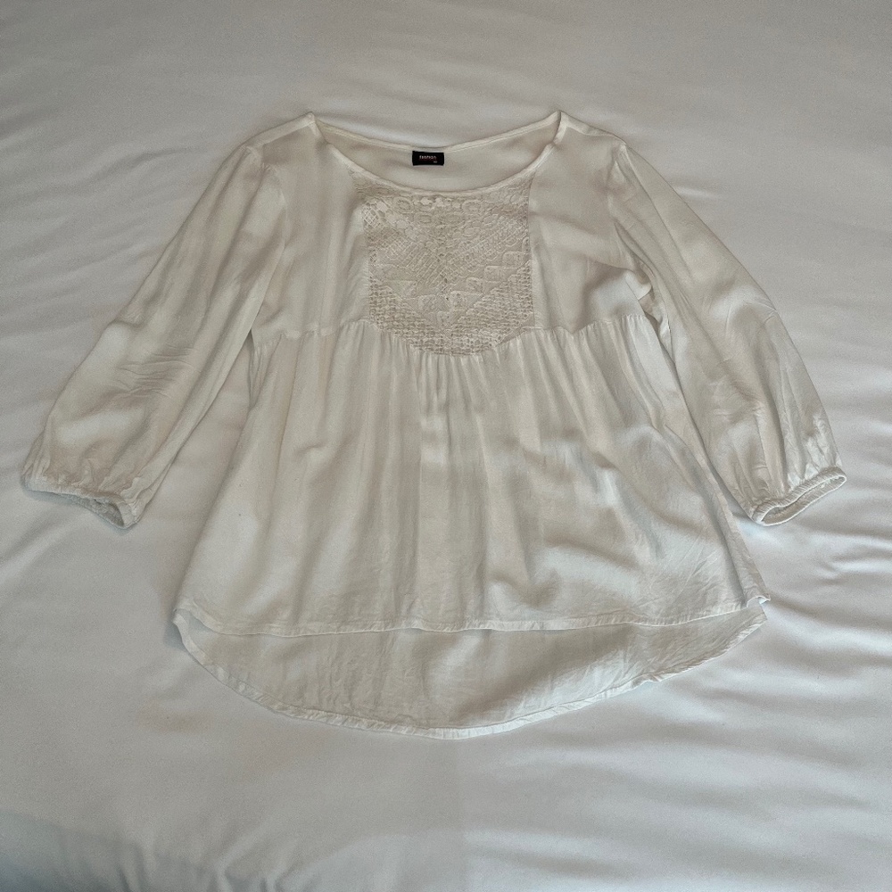 Vintage flowy white peplum-inspired blouse with lace panelling